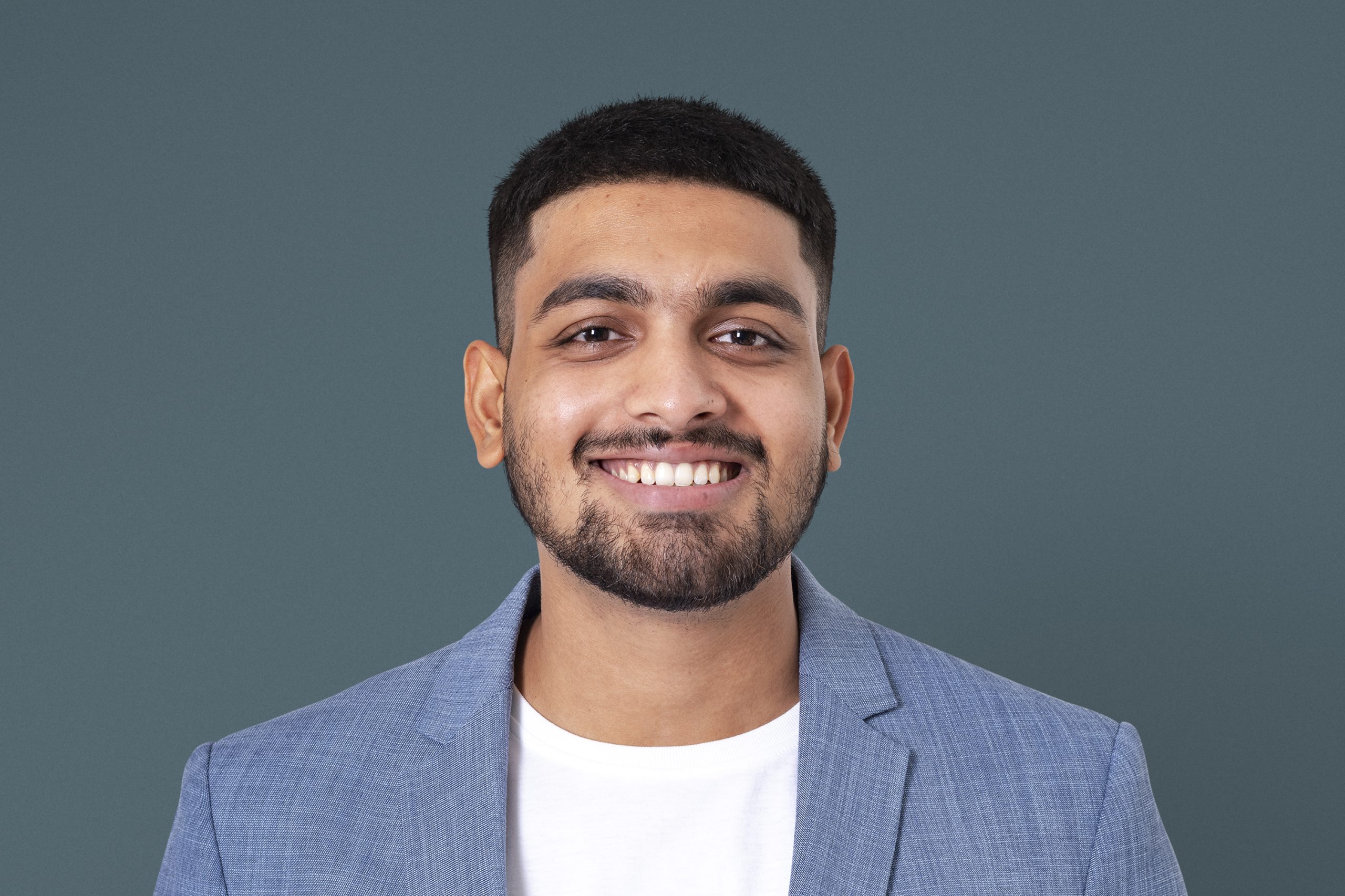 Cheerful Indian businessman smiling closeup portrait for jobs and career campaign